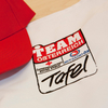 Team Österreich Tafel, Auf dem Bild eine Kappe mit Logo