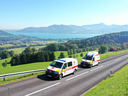 Zwei Einsatzfahrzeuge aus St. Georgen mit Blick auf den Attersee