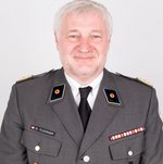 Thomas Fluckinger in der Rotkreuz-A-Uniform und im Portrait